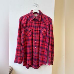 Vintage plaid flannel shirt with snap button closure. Made in USA.